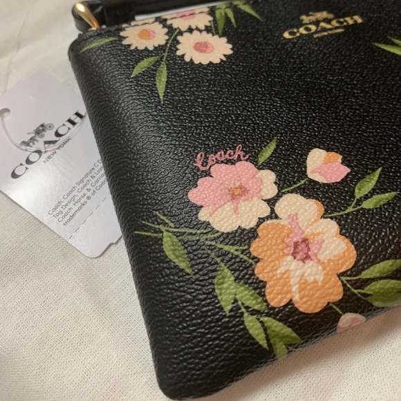 Coach | “Daisies” zipper Wristlets - Picture 3 of 8